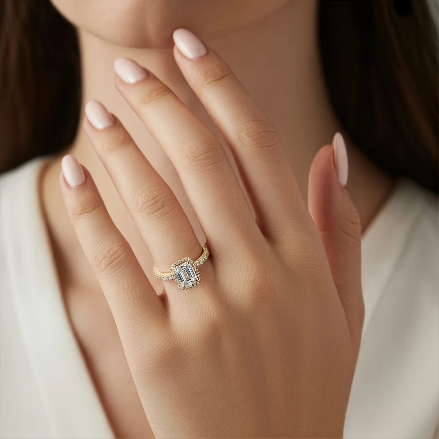 Oval diamond engagement ring on a hand