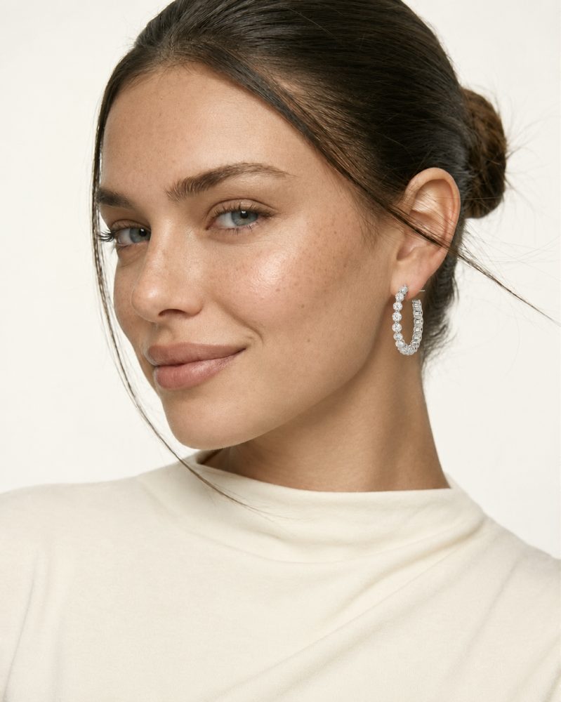 Woman wearing diamond hoop earrings