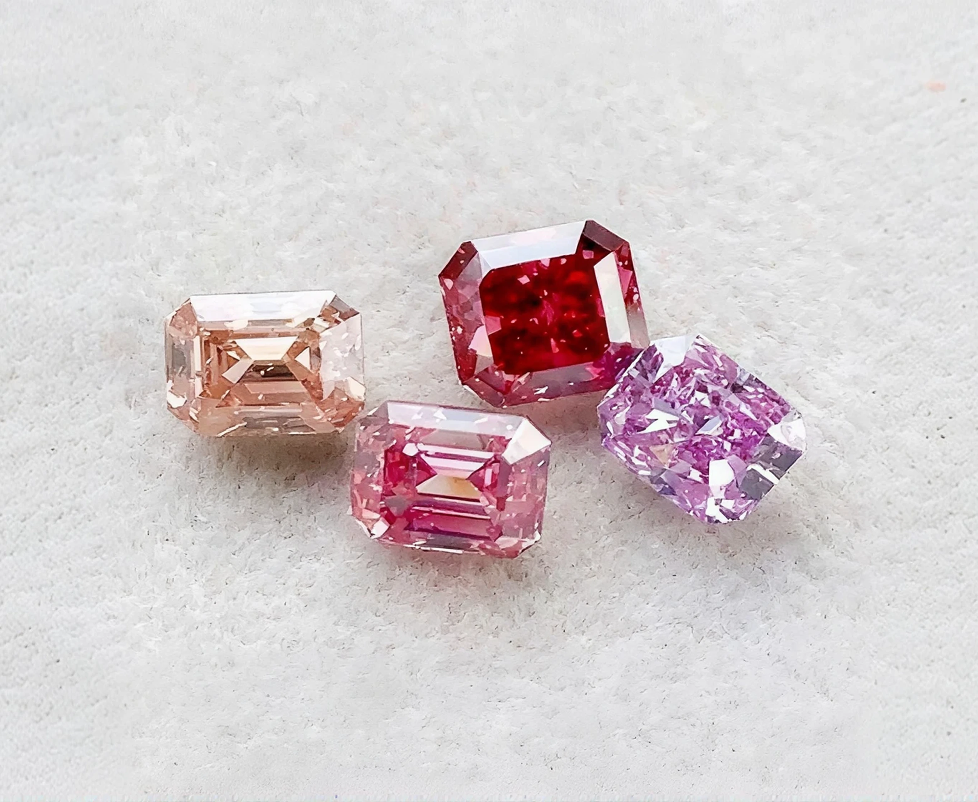 Pink, red, and champagne fancy color diamonds