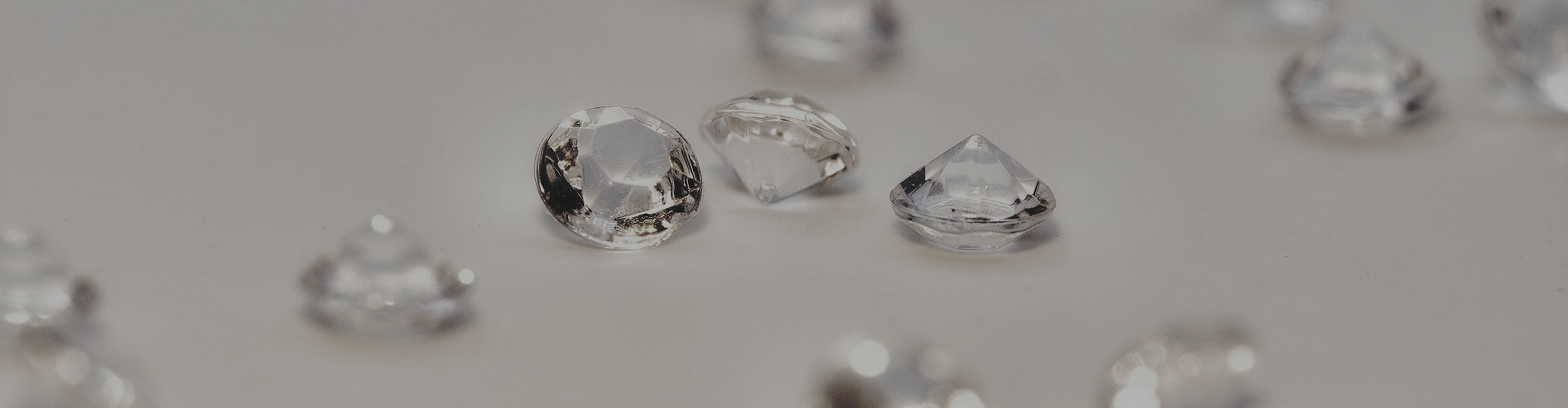 Assorted Lab-Grown Diamonds on a dark surface