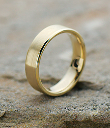 Gold wedding band on stone